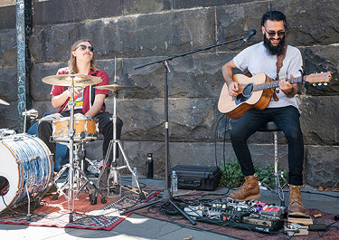 Buskers hit a high a note as live  music scene returns to city streets